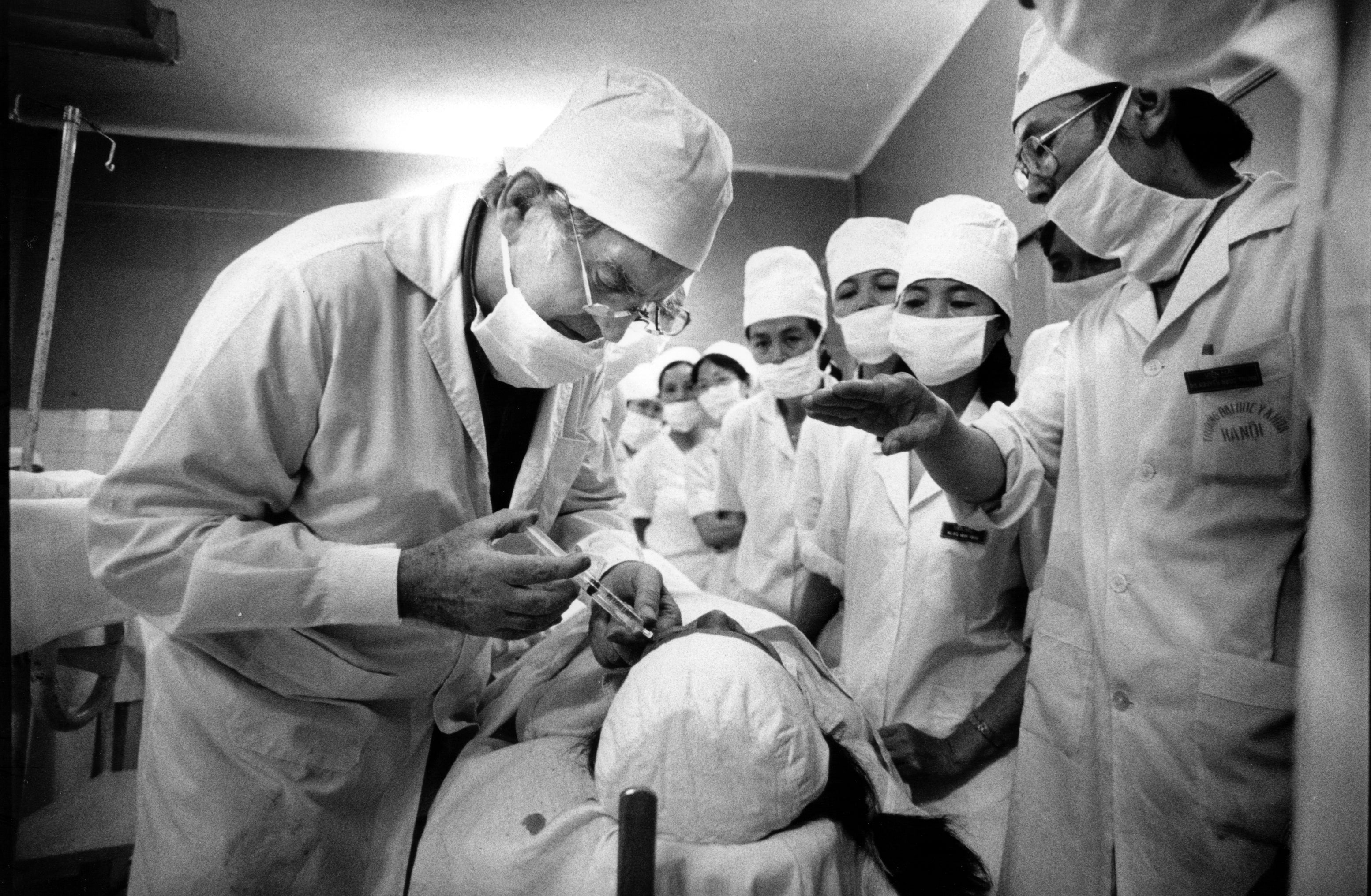 Doctor operating and helping patient to restore eyesight.