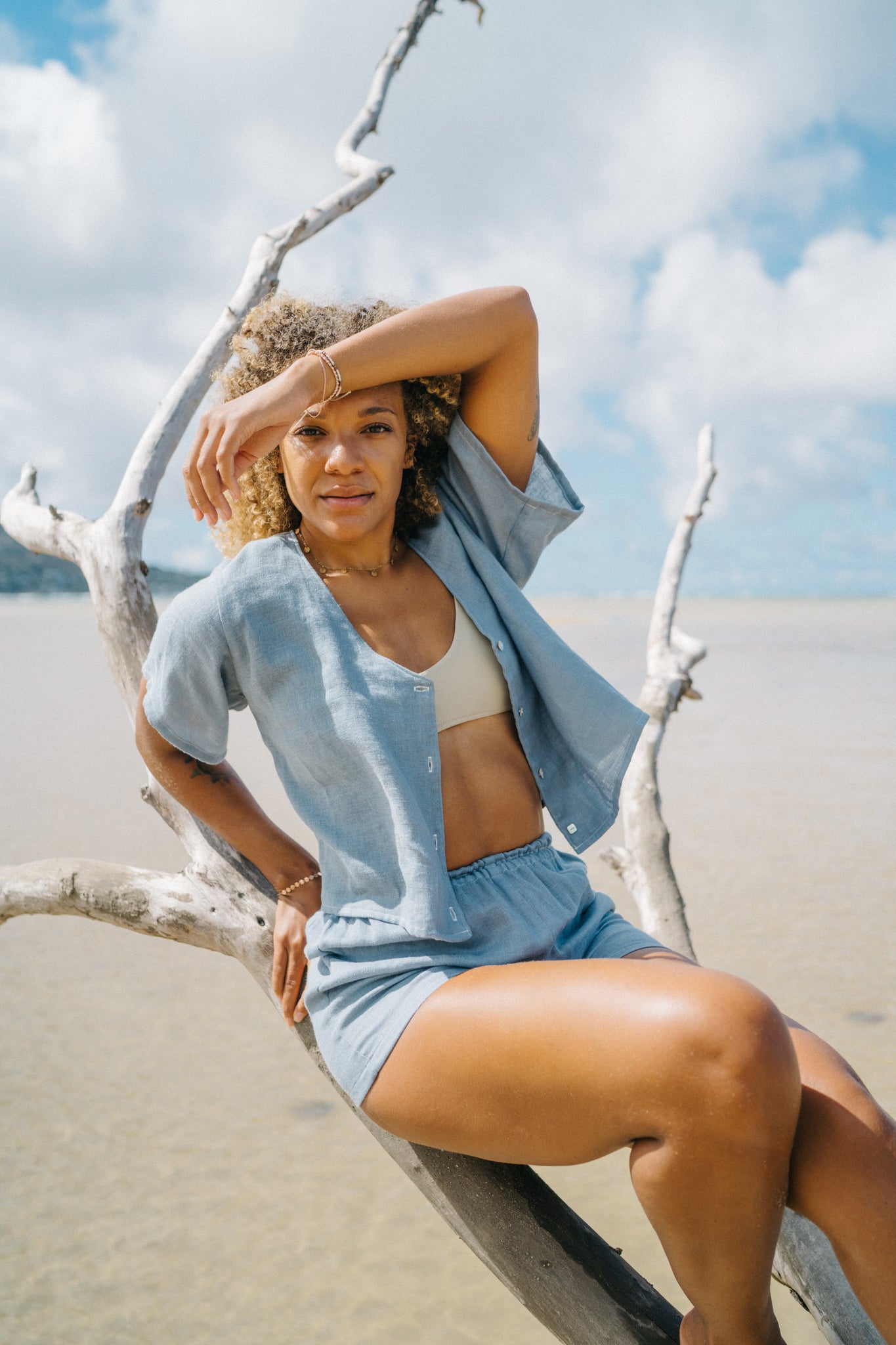 Girl wearing monochrome short sleeve top and shorts set in double gauze blue.